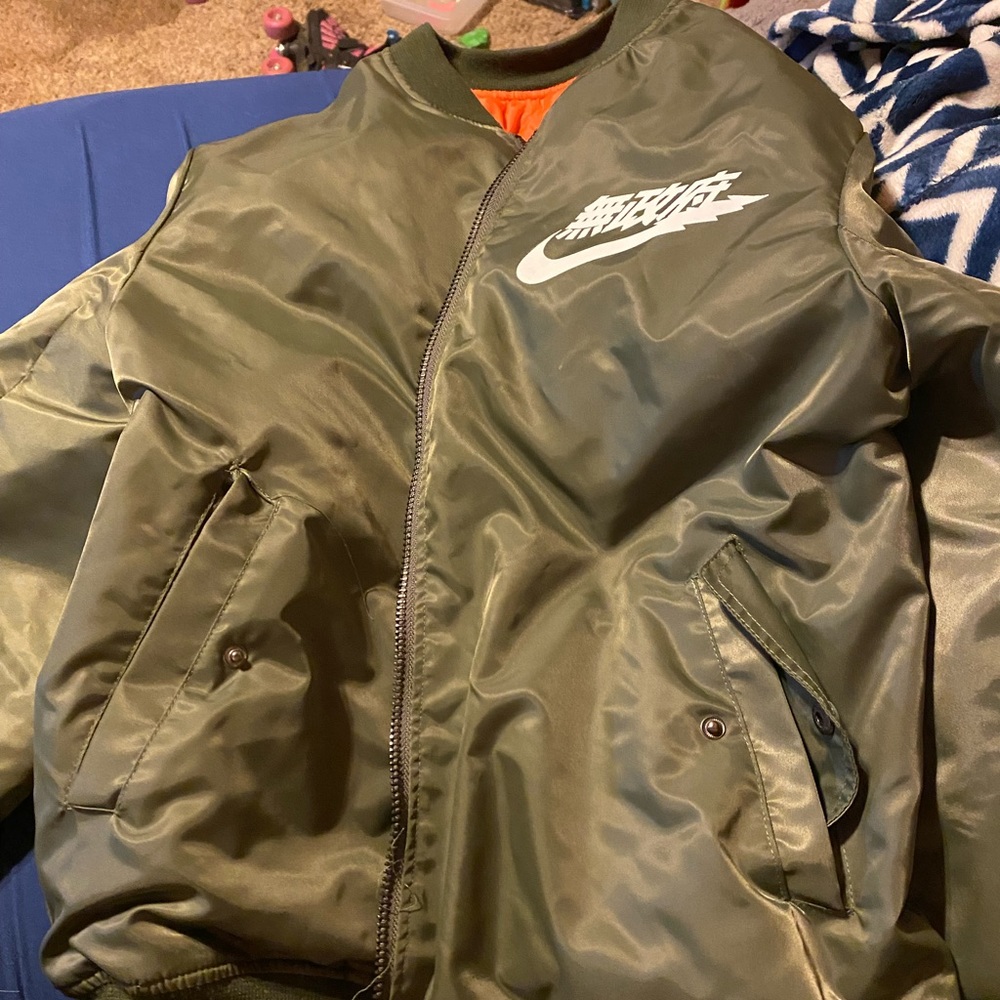 Limited edition YEEZUS Japan tour green and orange windbreaker.